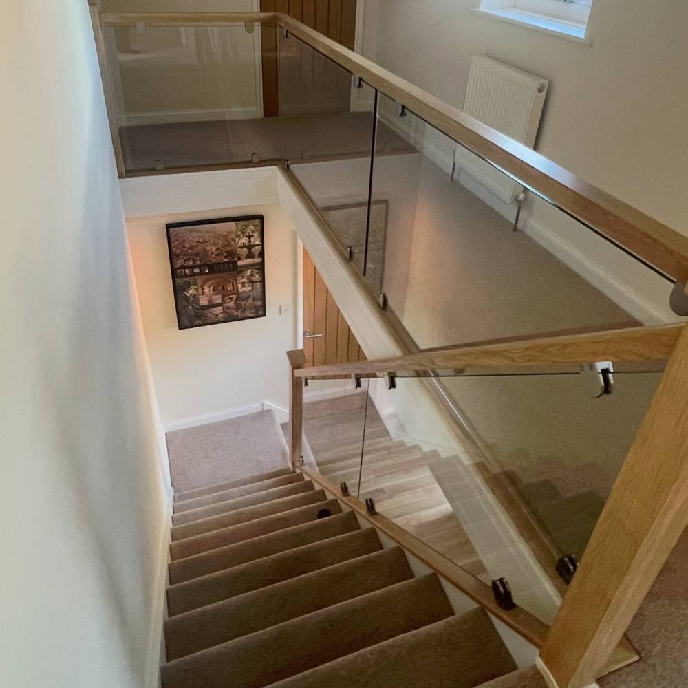 After: oak and glass balustrade staircase