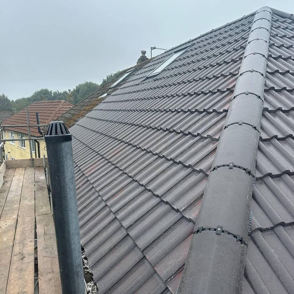 After: re-tiled roof with new ridge and roof windows