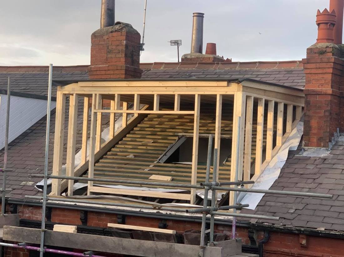 Timber frame of a dormer under construction