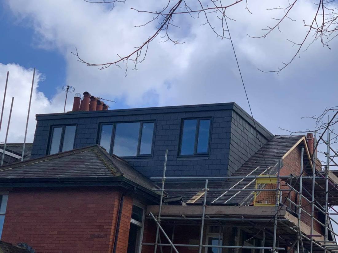 Finished dormer with slate cladding and black windows
