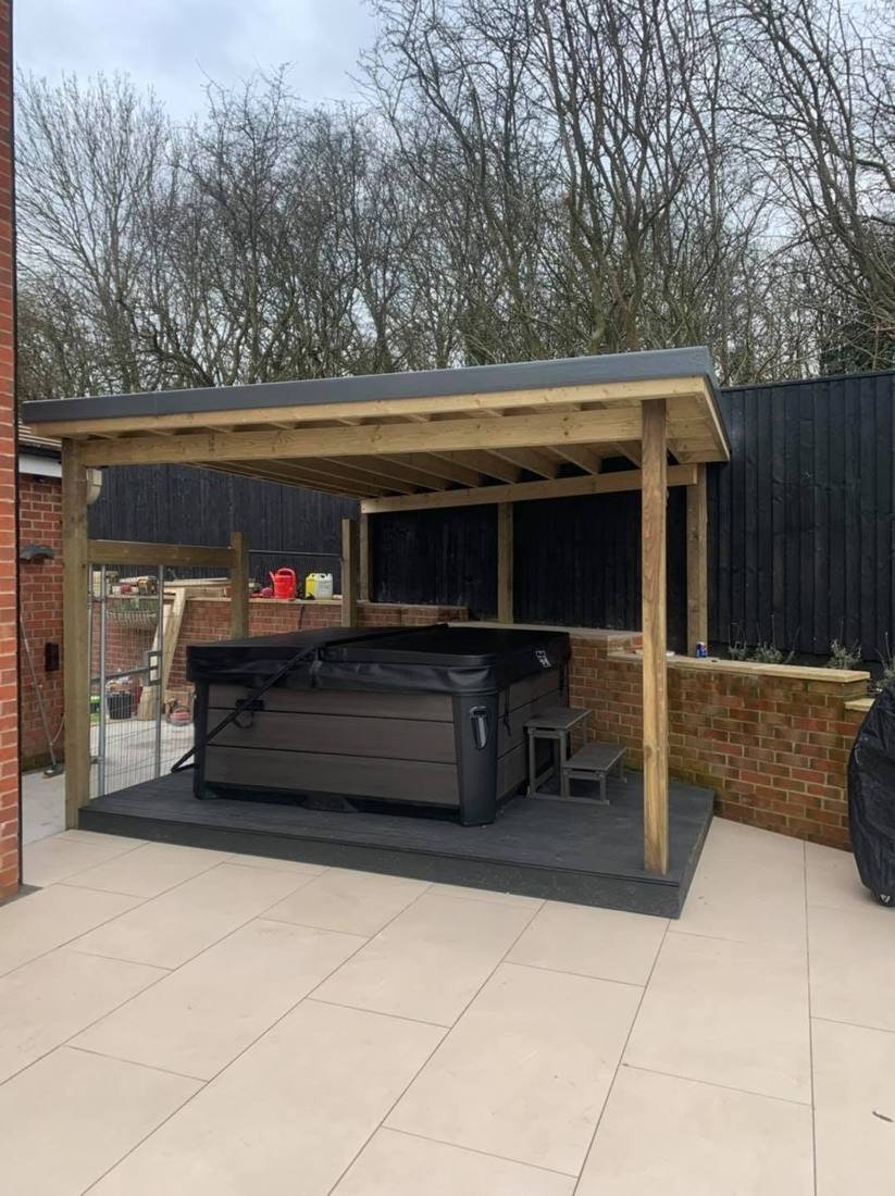 Timber hot tub shelter on a raised deck