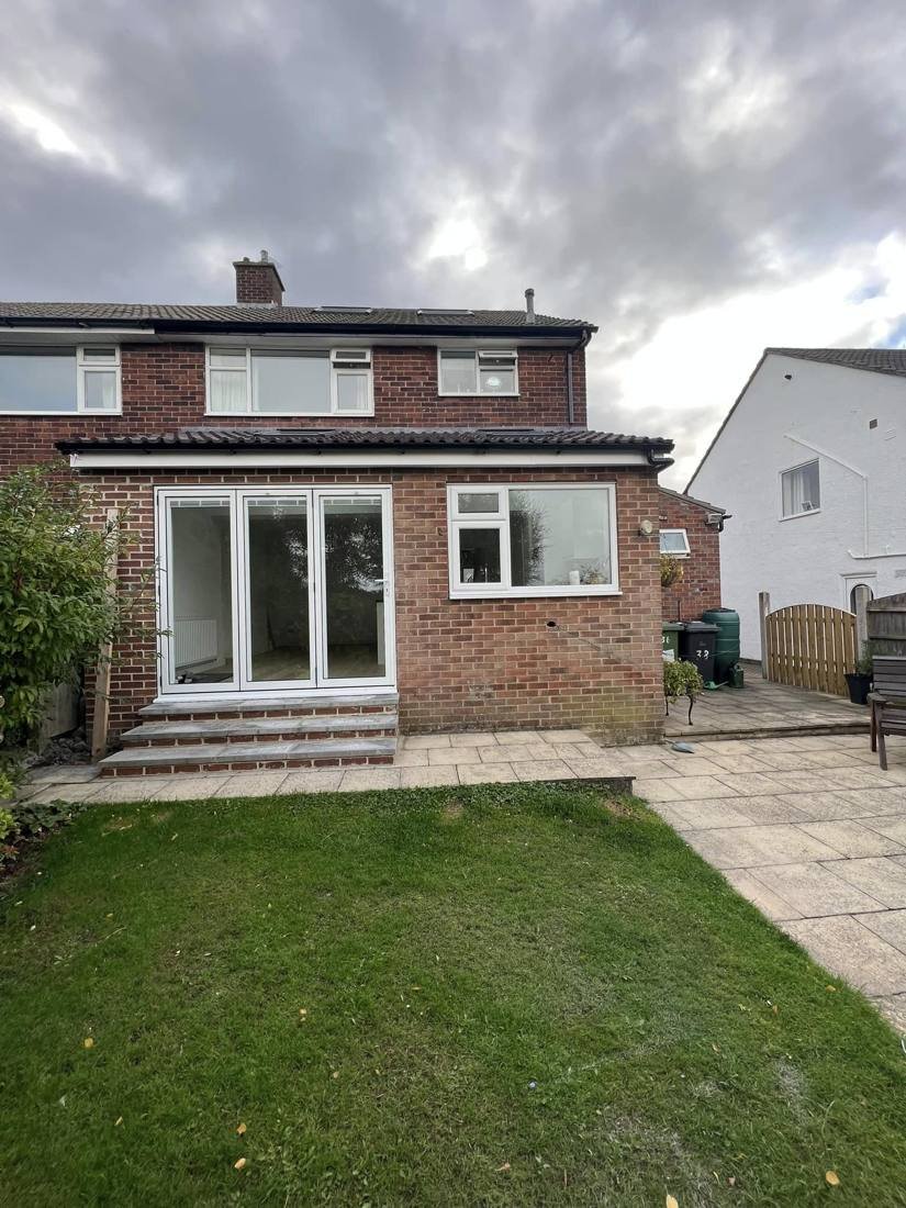 Rear extension with bi-fold doors and brick steps